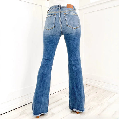 Jean slim rétro évasé taille haute stretch déchiré